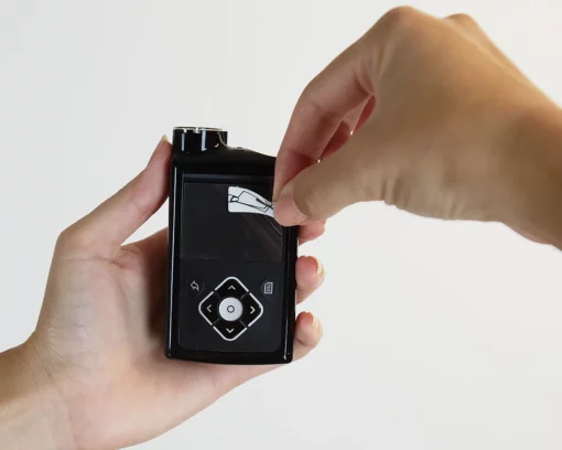 Close-up of screen film applied smoothly on MiniMed pump