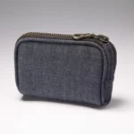 Denim insulin pump case clipped to belt with zipper closed
