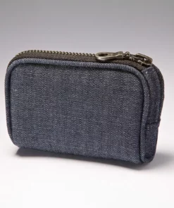 Denim insulin pump case clipped to belt with zipper closed
