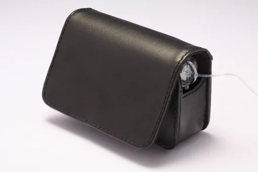 Black leather insulin pump case clipped on belt with flap closed