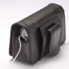 Black leather insulin pump case clipped on belt with flap closed