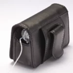 Black leather insulin pump case clipped on belt with flap closed