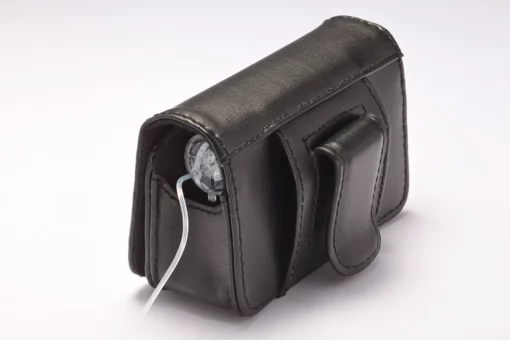Black leather insulin pump case clipped on belt with flap closed